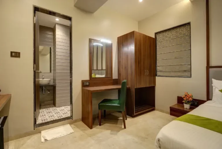 Staybird room with a bed bathroom and chairs
